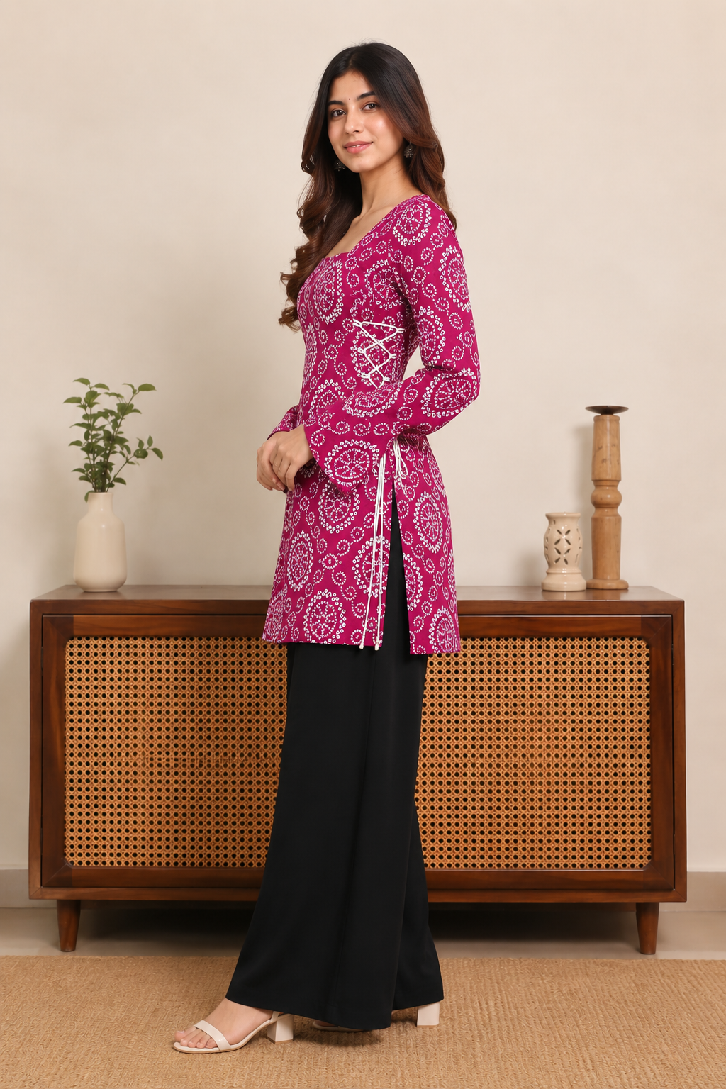 Elegant magenta printed kurti with stylish side lace-up detailing, flared sleeves and a comfortable straight silhouette