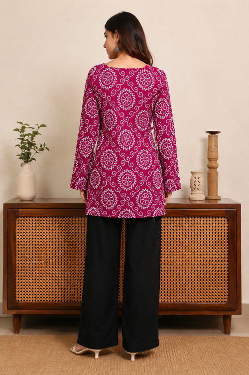 Elegant magenta printed kurti with stylish side lace-up detailing, flared sleeves and a comfortable straight silhouette